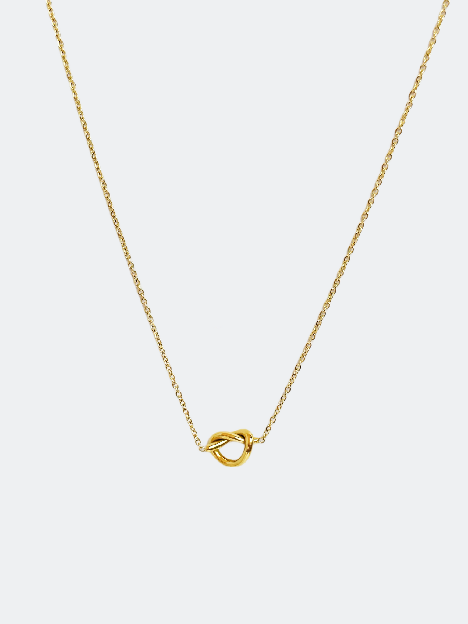 Halsband i stål med 18k guld med knut hänge