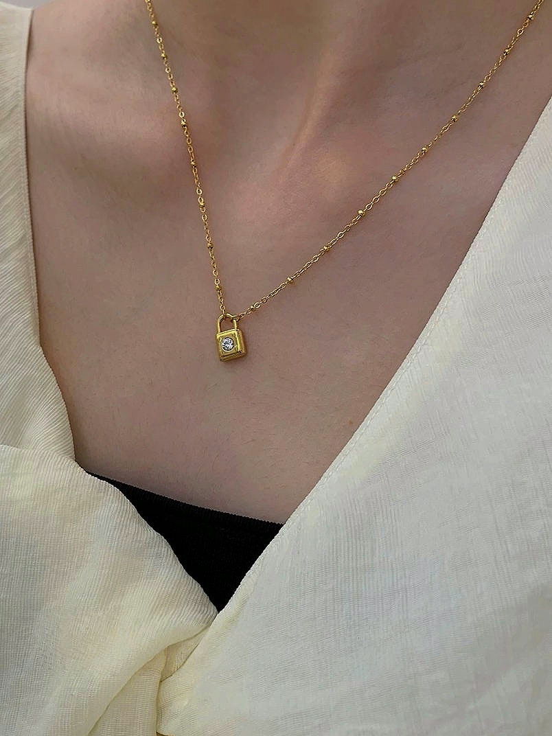 REA Halsband i stål med 18k guld med låsa och Cubic Zirconia