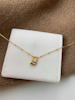 REA Halsband i stål med 18k guld med låsa och Cubic Zirconia