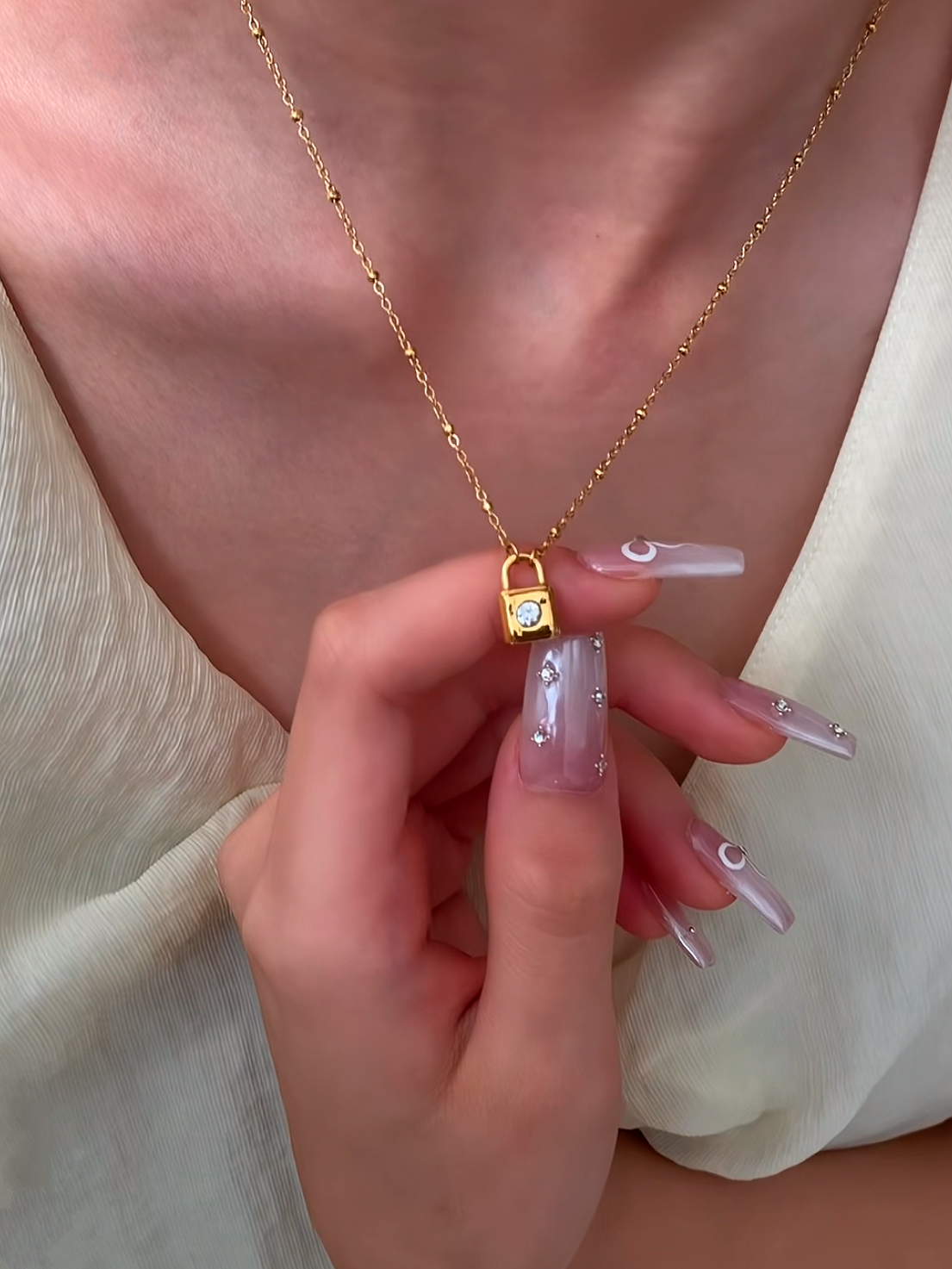 REA Halsband i stål med 18k guld med låsa och Cubic Zirconia
