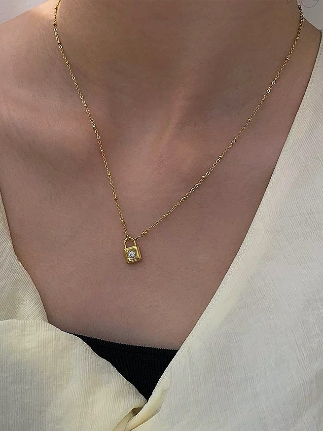 REA Halsband i stål med 18k guld med låsa och Cubic Zirconia