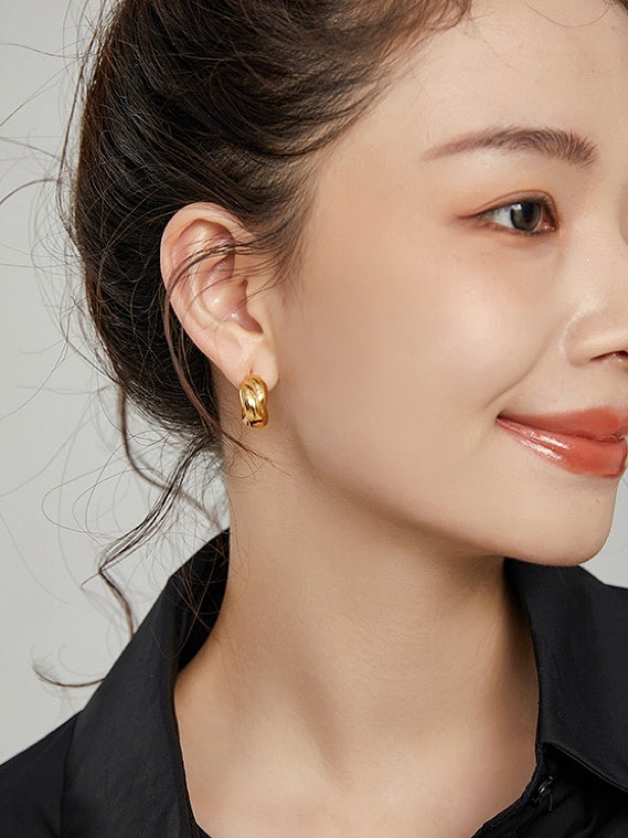 Chunky hoops i stål med 18K guld med tvinnad design
