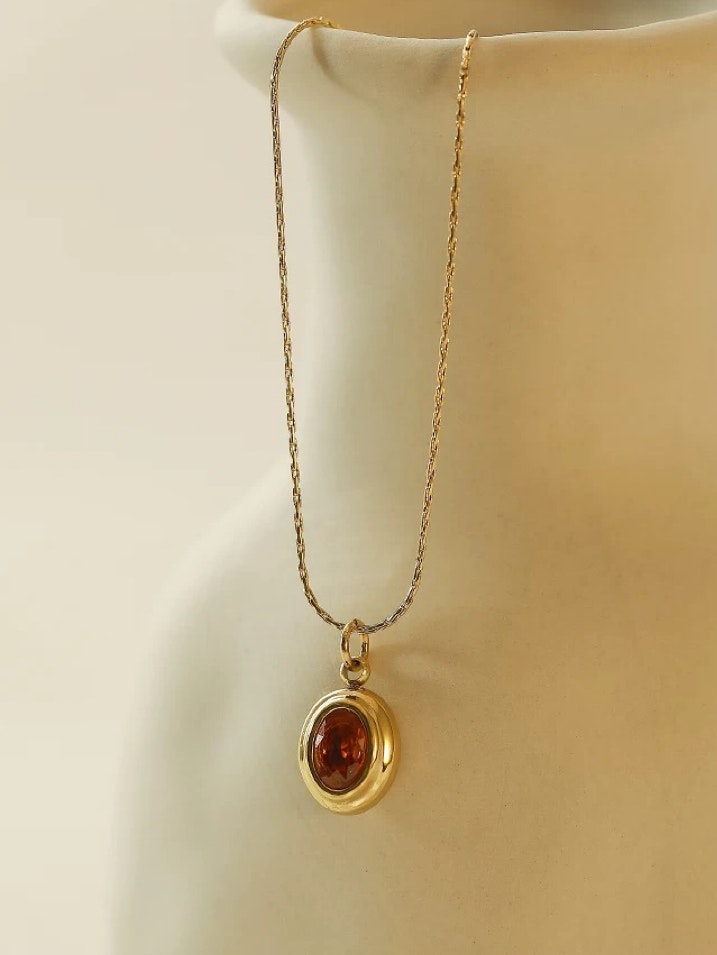 Halsband i stål med 18k guld med röd Cubic Zirconia