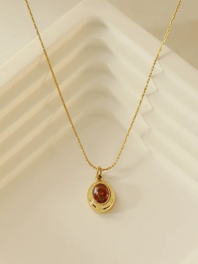 Halsband i stål med 18k guld med röd Cubic Zirconia