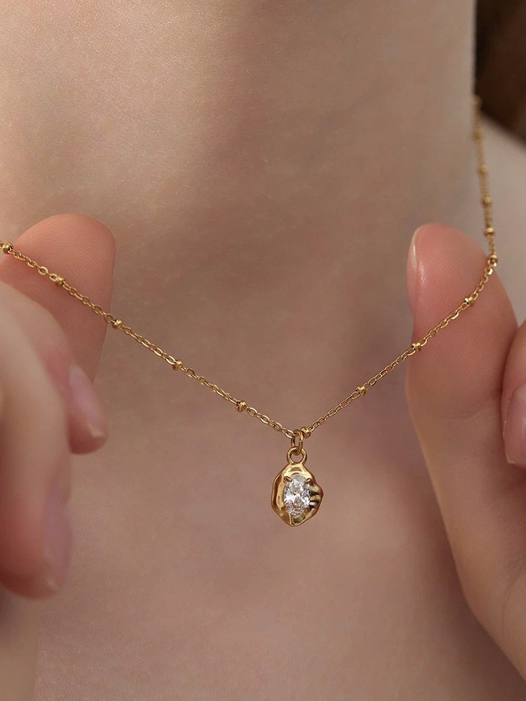 Halsband i stål med 18k guld med Cubic Zirconia