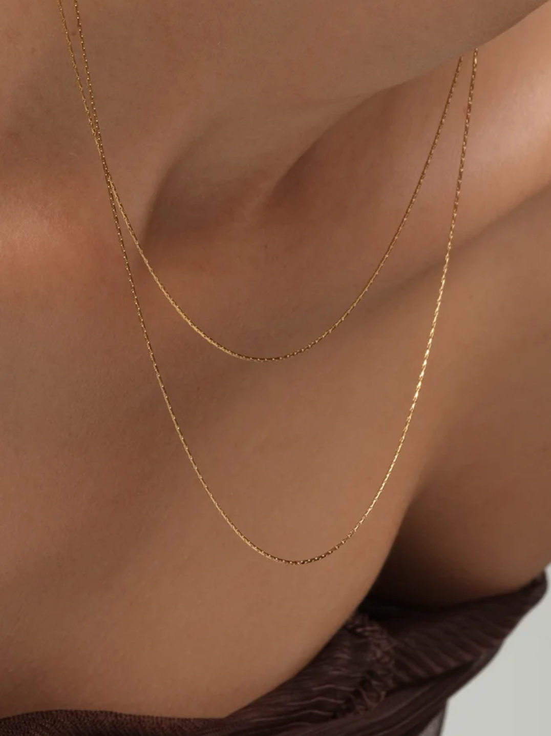 Halsband i stål med 18K guld med glasstenar