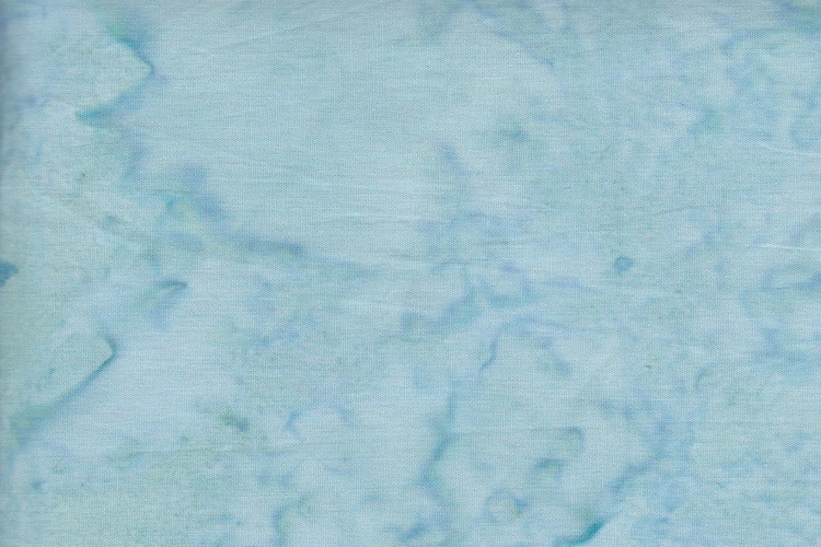 Ljusblå-turkos melerat bomullstyg. Bredd 110 cm.