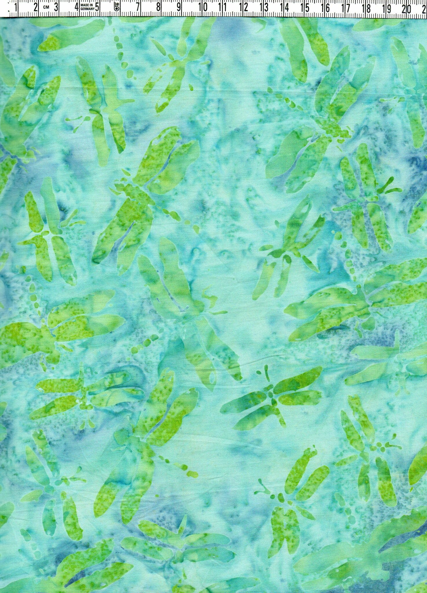 Trollsländor i gröna toner på blåturkos bakgrund