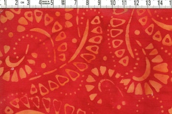 En sensation i rött gulorange   Bomullsbatik bredd 110 cm