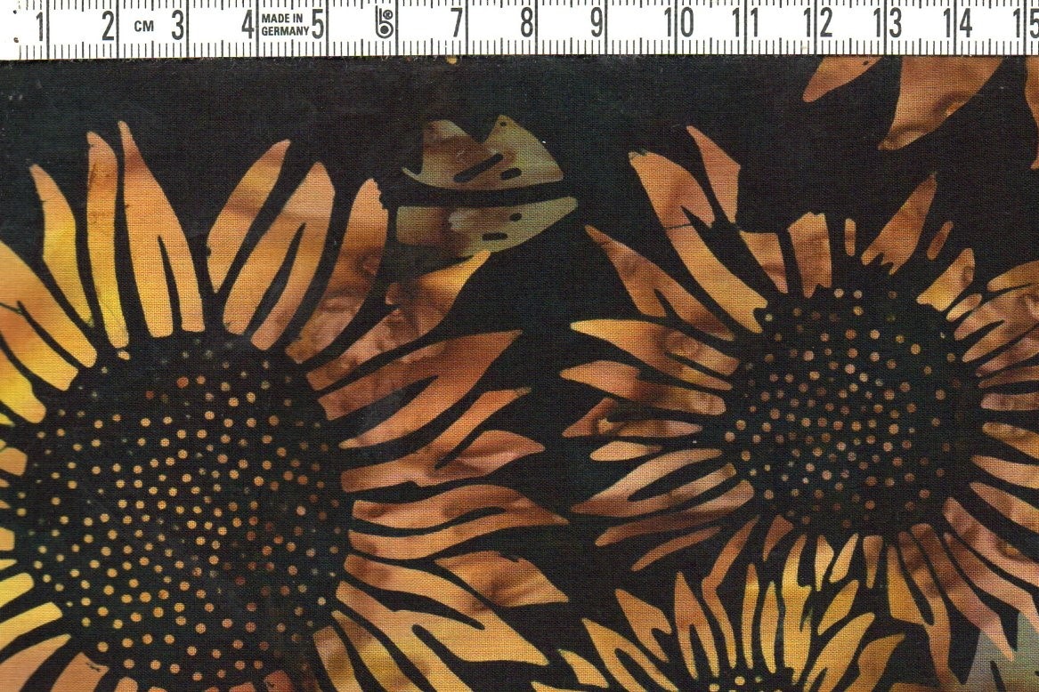 Svart med magnifika solrosor. Batik bomull 110 cm