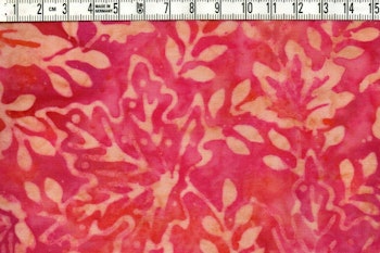 Röd-cerise-lila-beige med löv. Viskosbatik 110 cm bred