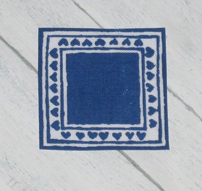 Liten blå duk ca 42 x 42 mm