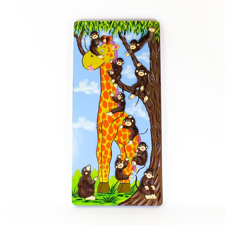 Pussel med små apor, numrerade 1 - 10, som klättrar på en giraff och i ett träd.