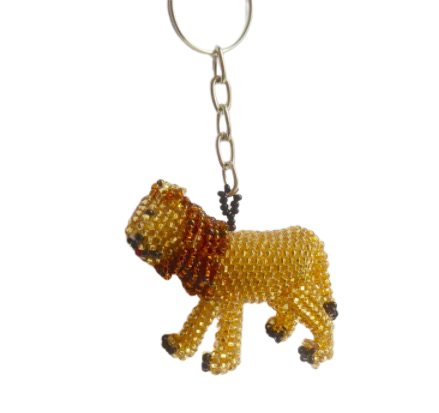Nyckelring med ett lejon, handpärlad av pyttesmå glaspärlor. Fair Trade från Guatemala.