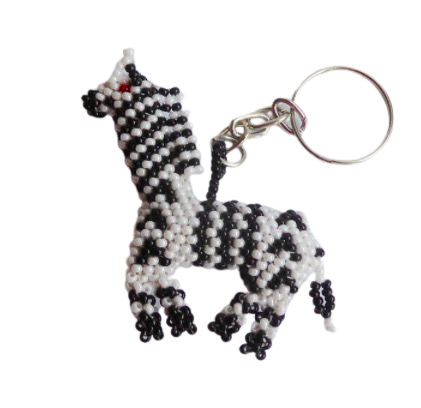 Nyckelringar av små glaspärlor: zebra. Tålmodigt handarbete för Fair Trade. Guatemala.