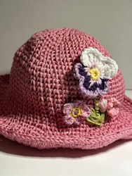 Rosa hatt med blommor