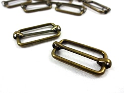 S646 Rörlig spännare metall 25 mm antikguld (10/100 st)