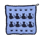Mellanblå grytlapp med marinblå katter