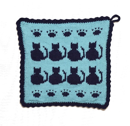 Ljusblå grytlapp med marinblå katter