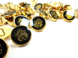 K175 Knapp Emblem 15 mm svart/guld