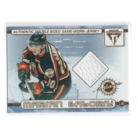 2001-02 Titanium Double-Sided Jerseys #67 Marian Gaborik Manny Fernandez (40-X205-NHLWILD)