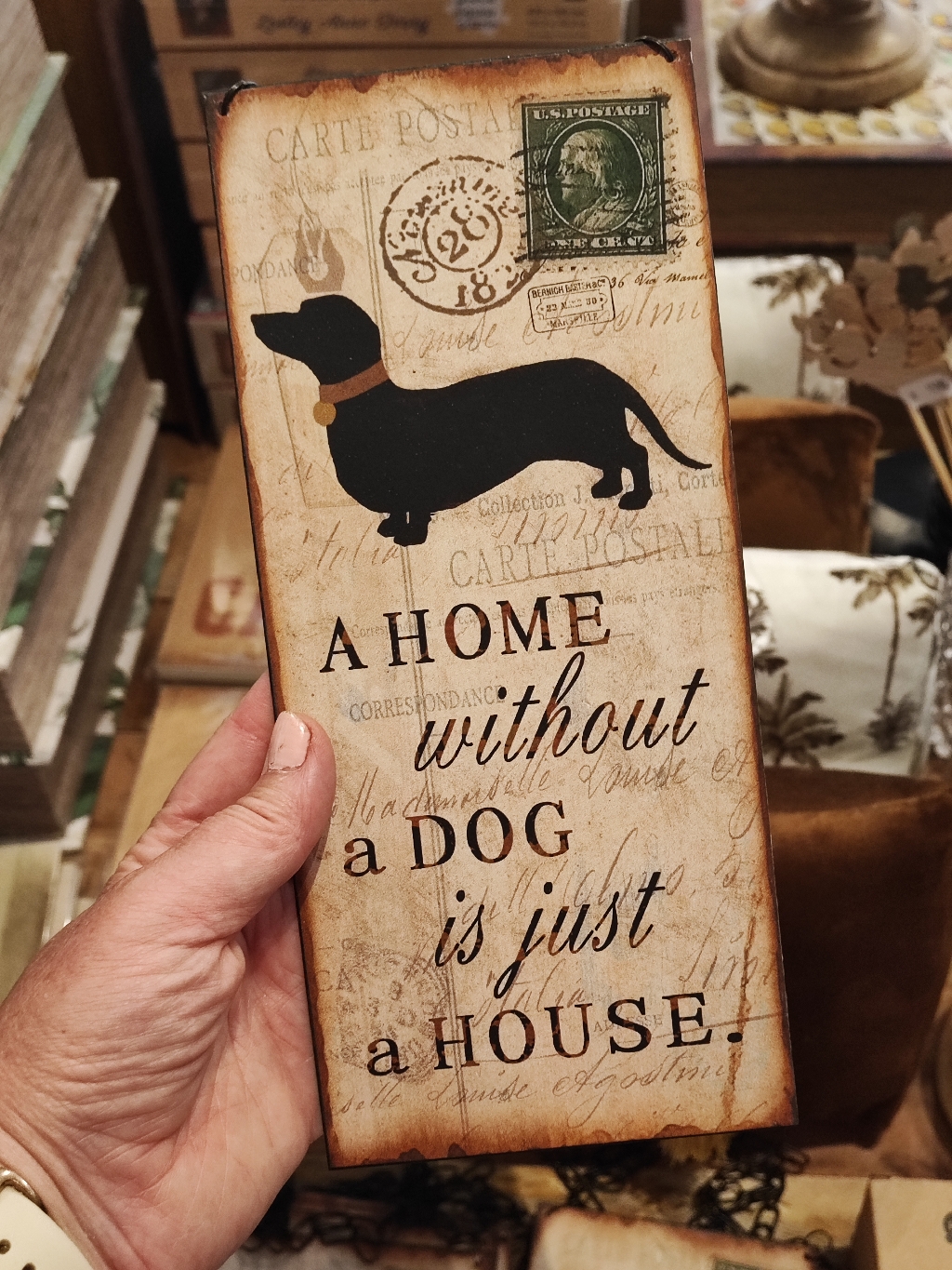 Plåtskylt, "A home without a dog..."