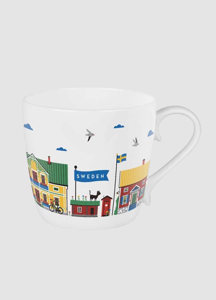 Vit mugg i benporslin med klassiska svenska hus
