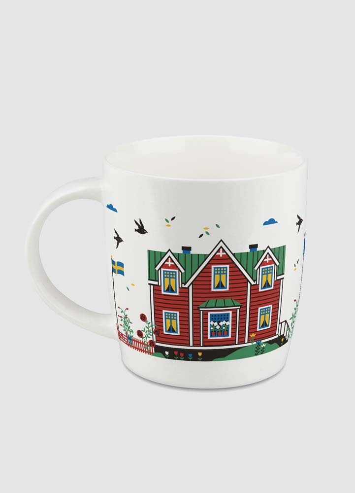 Liten porslinsmugg med röda svenska hus