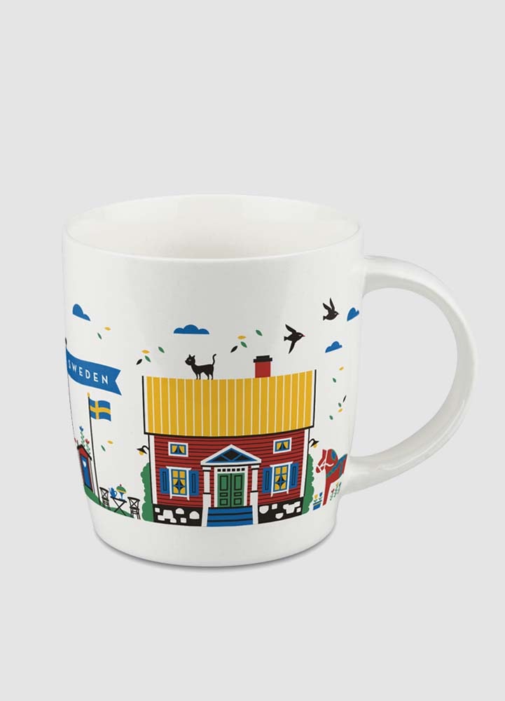 Liten porslinsmugg med röda svenska hus