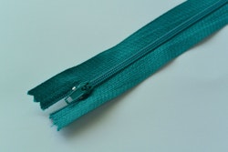 20 cm dragkedja. Grönblå.