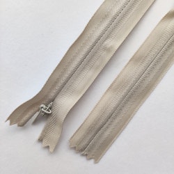 Osynligt, dolt blixtlås, 25 cm. Ljus gråbeige.