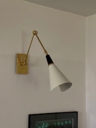 Pair of Brass Wall Lamps in the Style of Stilnovo, black & white.