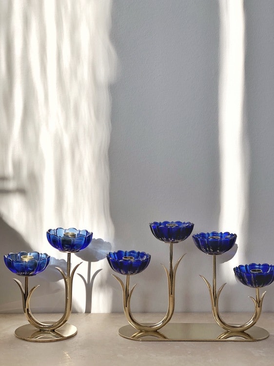 Gunnar Ander set of 2 Brass Candle Holders by Ystad Metall with blue glass flowers. 1960s.