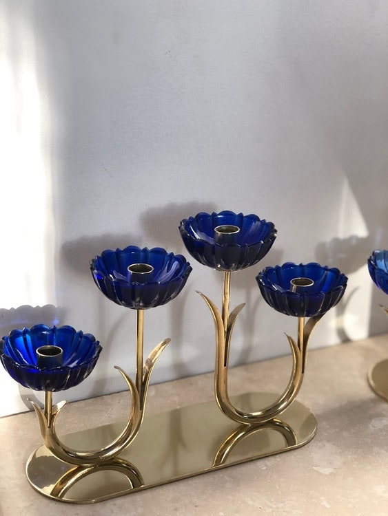 Gunnar Ander set of 2 Brass Candle Holders by Ystad Metall with blue glass flowers. 1960s.