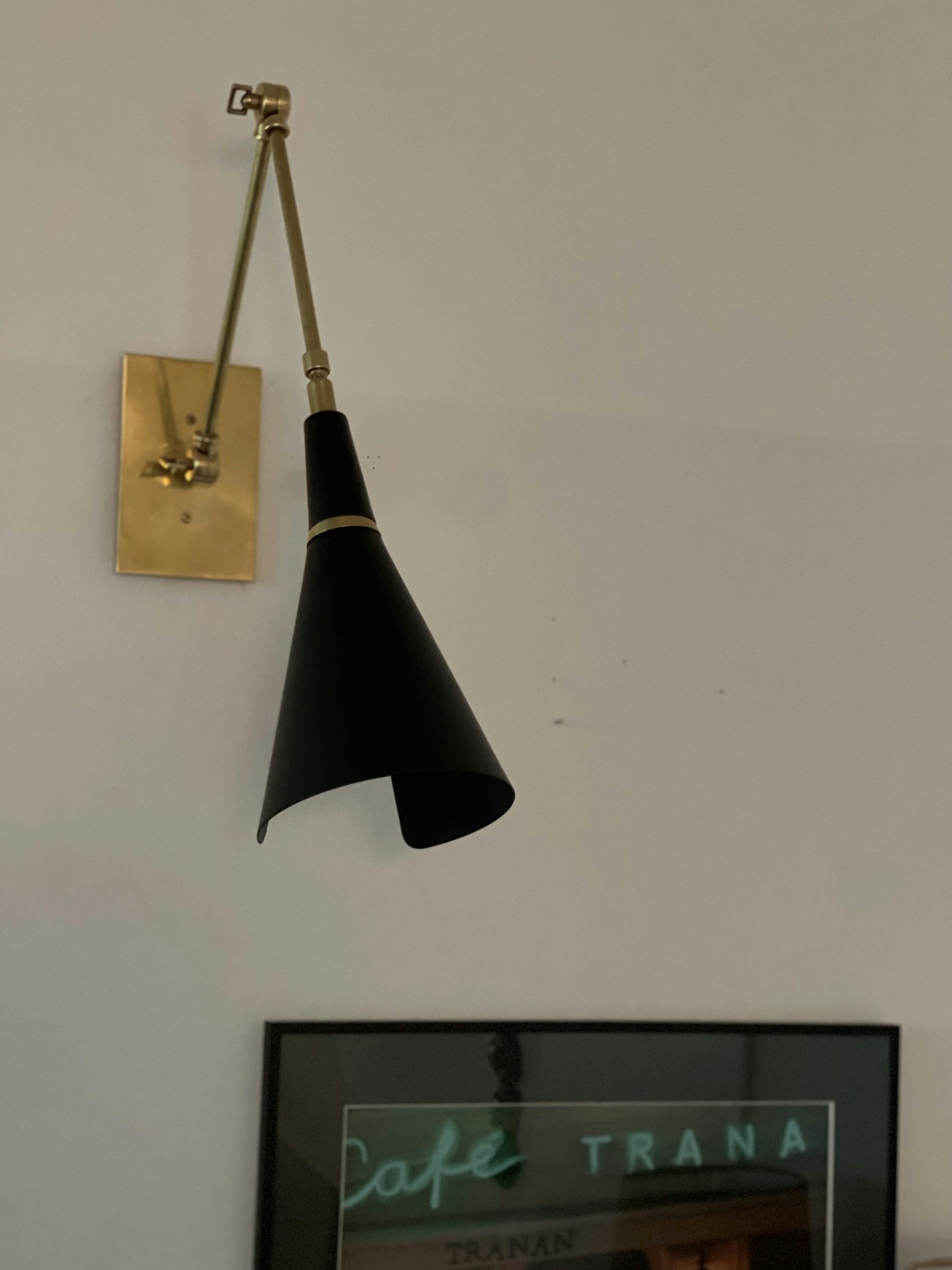 Pair of Black Wall Lamps in the Style of Stilnovo.