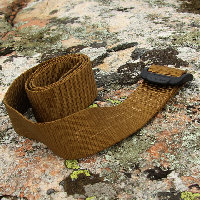 Outdoors photo with stone and lava background of a Expedition Belt Coyote.