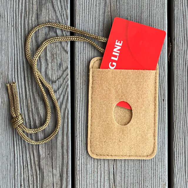 A Card holder Hook and Loop Tan with a red card in it