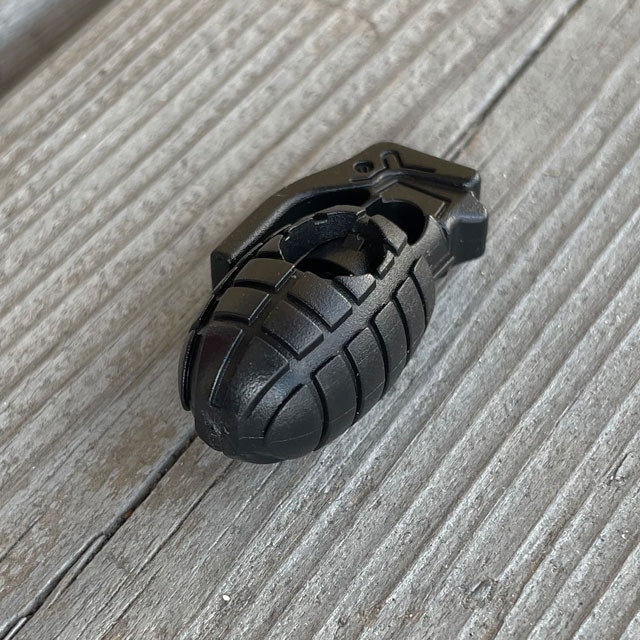 A Cord Lock Grenade Black from TAC-UP GEAR seen from an angle