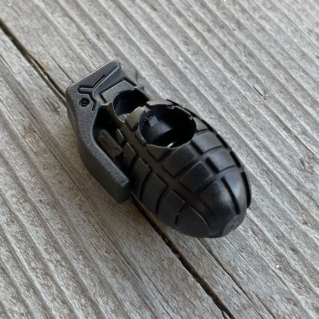 Side view of a Cord Lock Grenade Black from TAC-UP GEAR