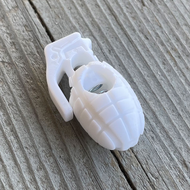 A Cord Lock Grenade White from TAC-UP GEAR seen from an angle