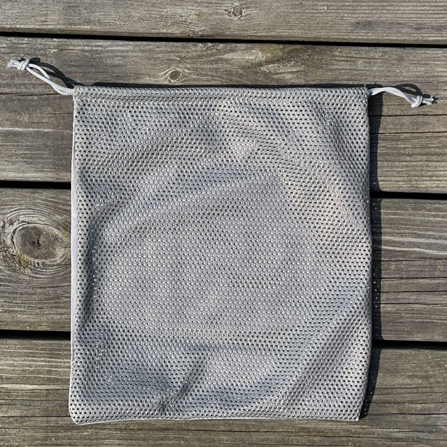 The backside of a Drawstring Net Pouch Grey from TAC-UP GEAR