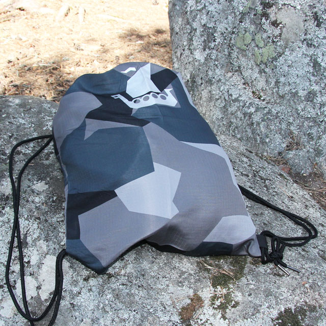 The great looking Drawstring Sports Bag M90 Grey seen on a large stone