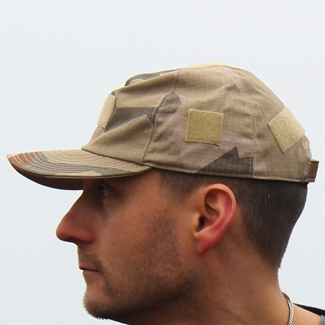 Field Cap M90K Desert wiht blue sky background.