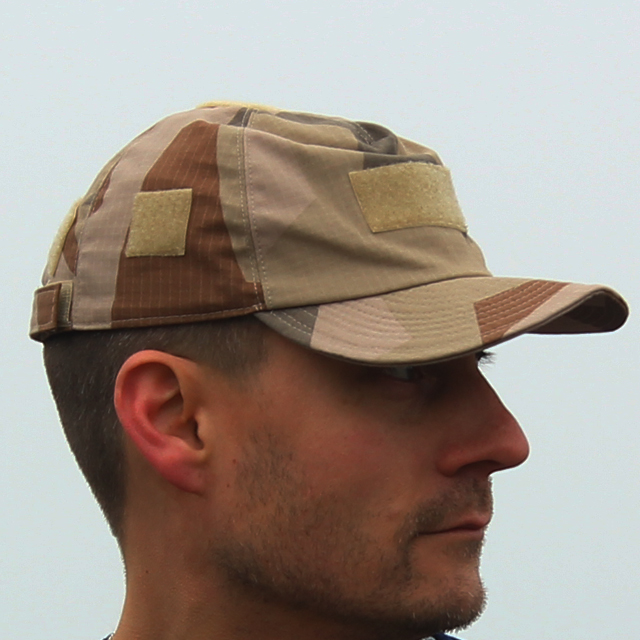 Sideview of a Field Cap M90K Desert worn outside on photoshoot.