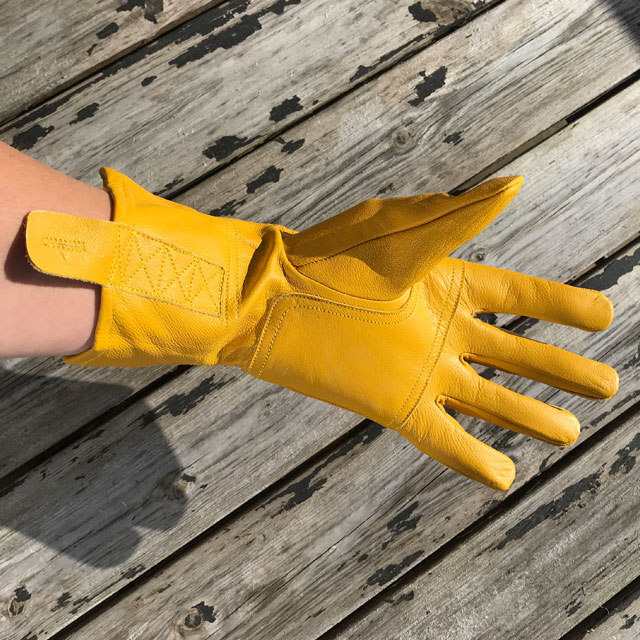 Palm and wrist area on a yellow color Bushcraft Leather Glove.