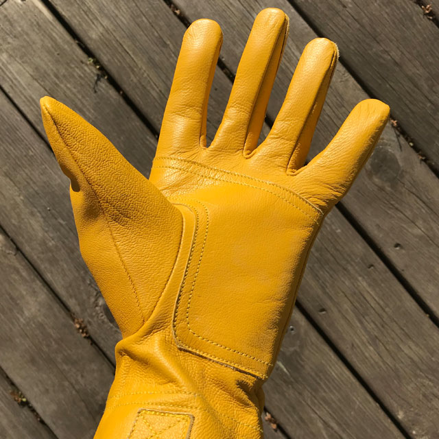 Open hand on a yellow goatskin Bushcraft Leather Glove.