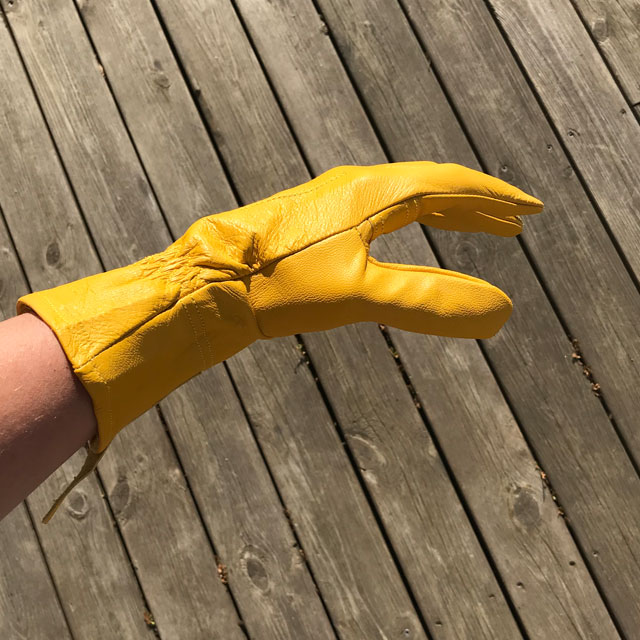Sideview of a yellow goatskin Bushcraft Leather Glove.