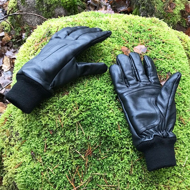 Officer Black Leather Gloves on a mossy stone in Swedish nature.