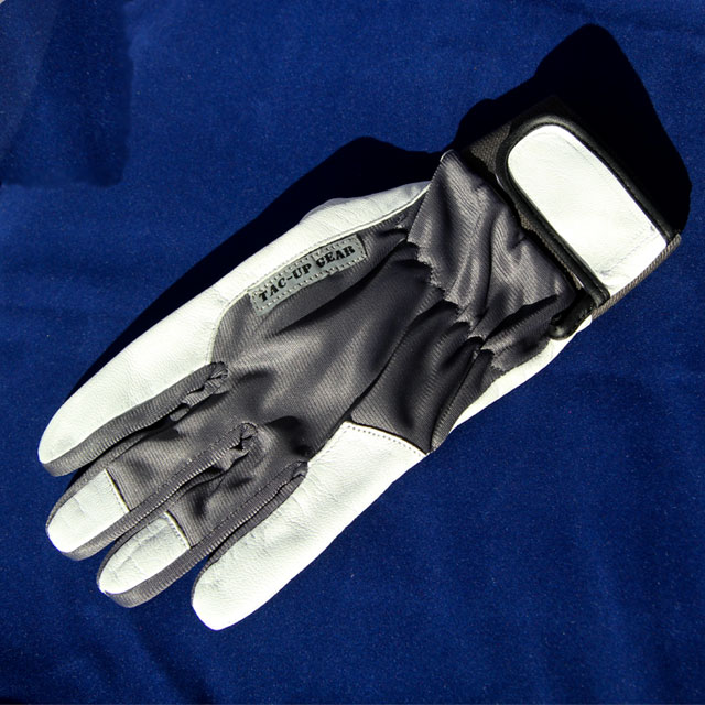 Showing full glove on blue background.