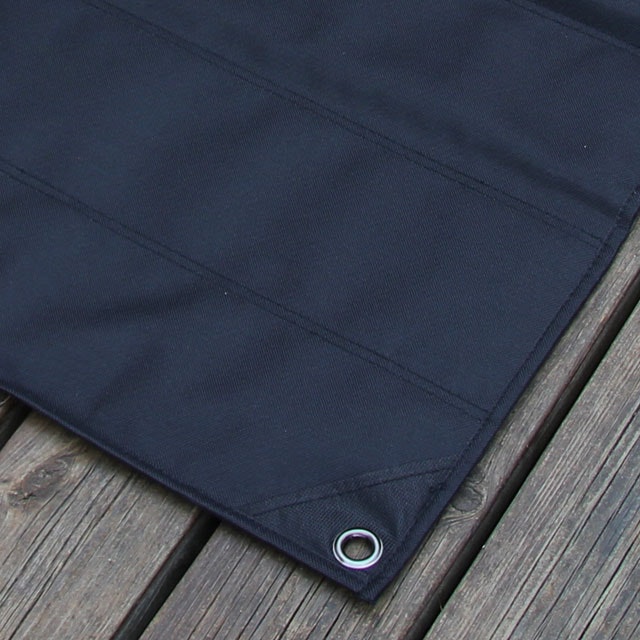 Backside and corner with eyelet of a Kardborre Wall Mat Display Black.